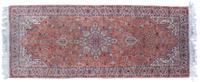 A Silk and Wool Rug 6 feet 5 inches x 2 feet 7 inches.