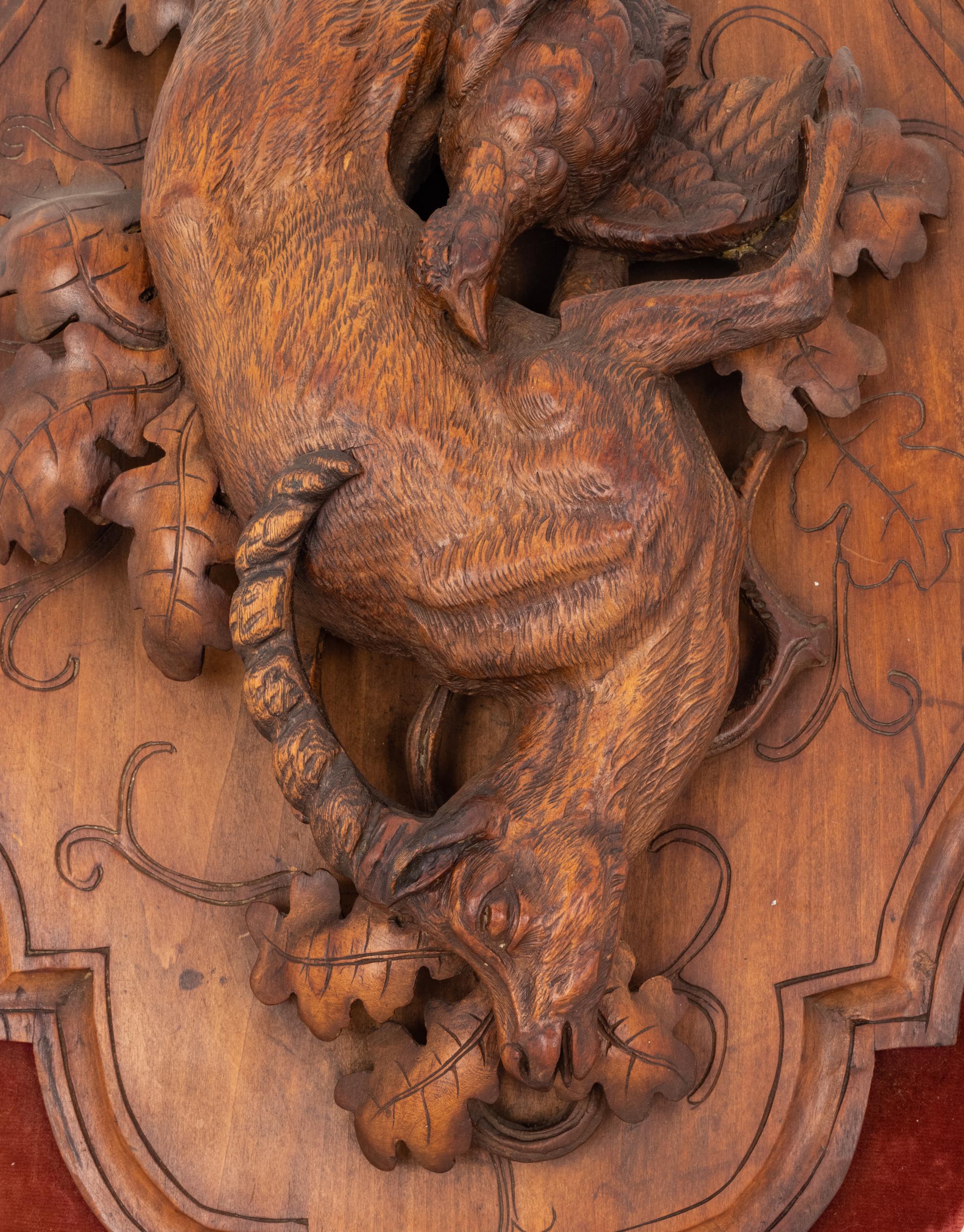 A Black Forest Carved Game Plaque