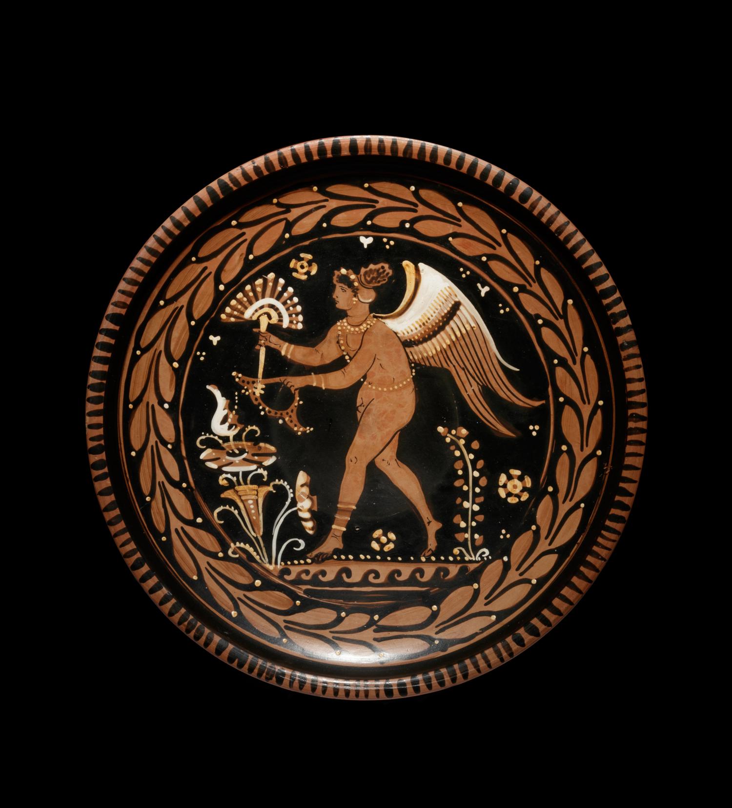An Apulian Red-Figured Plate with Striding Eros