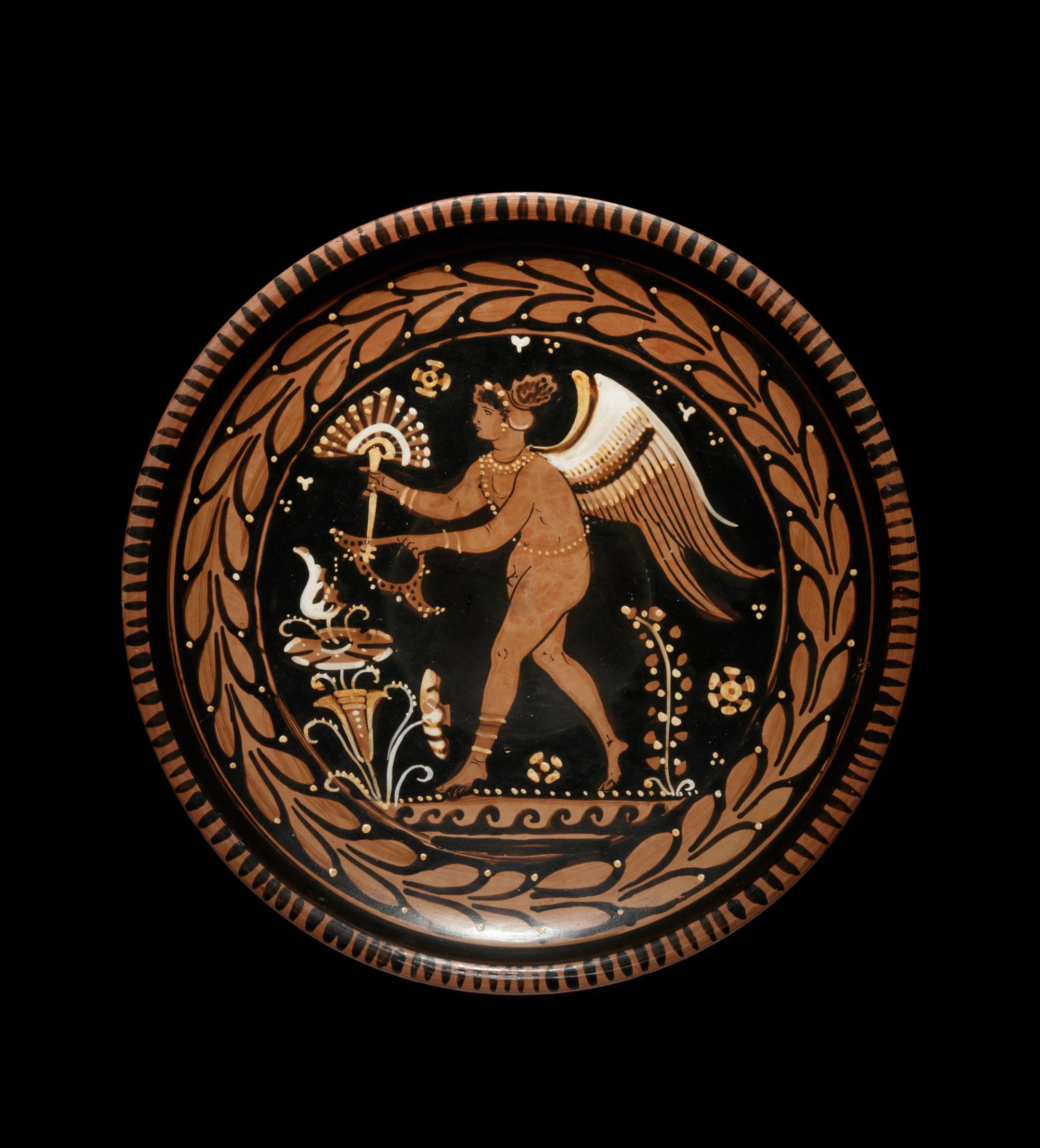 An Apulian Red-Figured Plate with Striding Eros