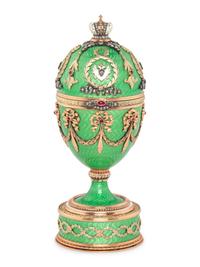 A Gold, Guilloché Enamel and Gemstone-Mounted Surprise Egg
