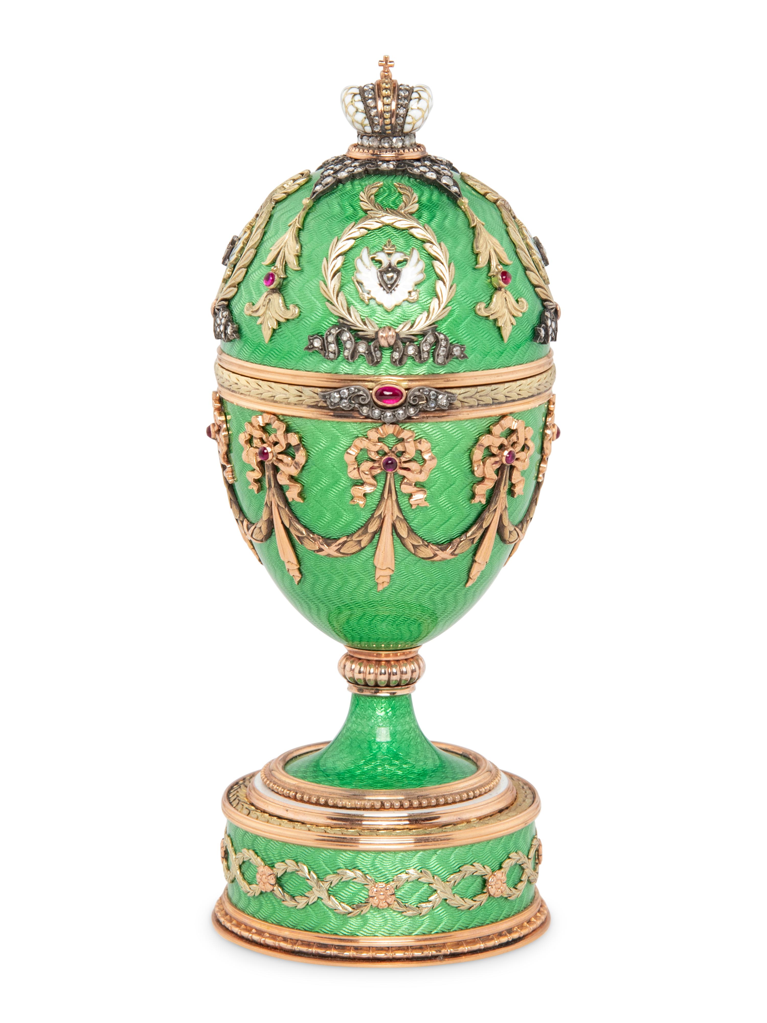 A Gold, Guilloché Enamel and Gemstone-Mounted Surprise Egg