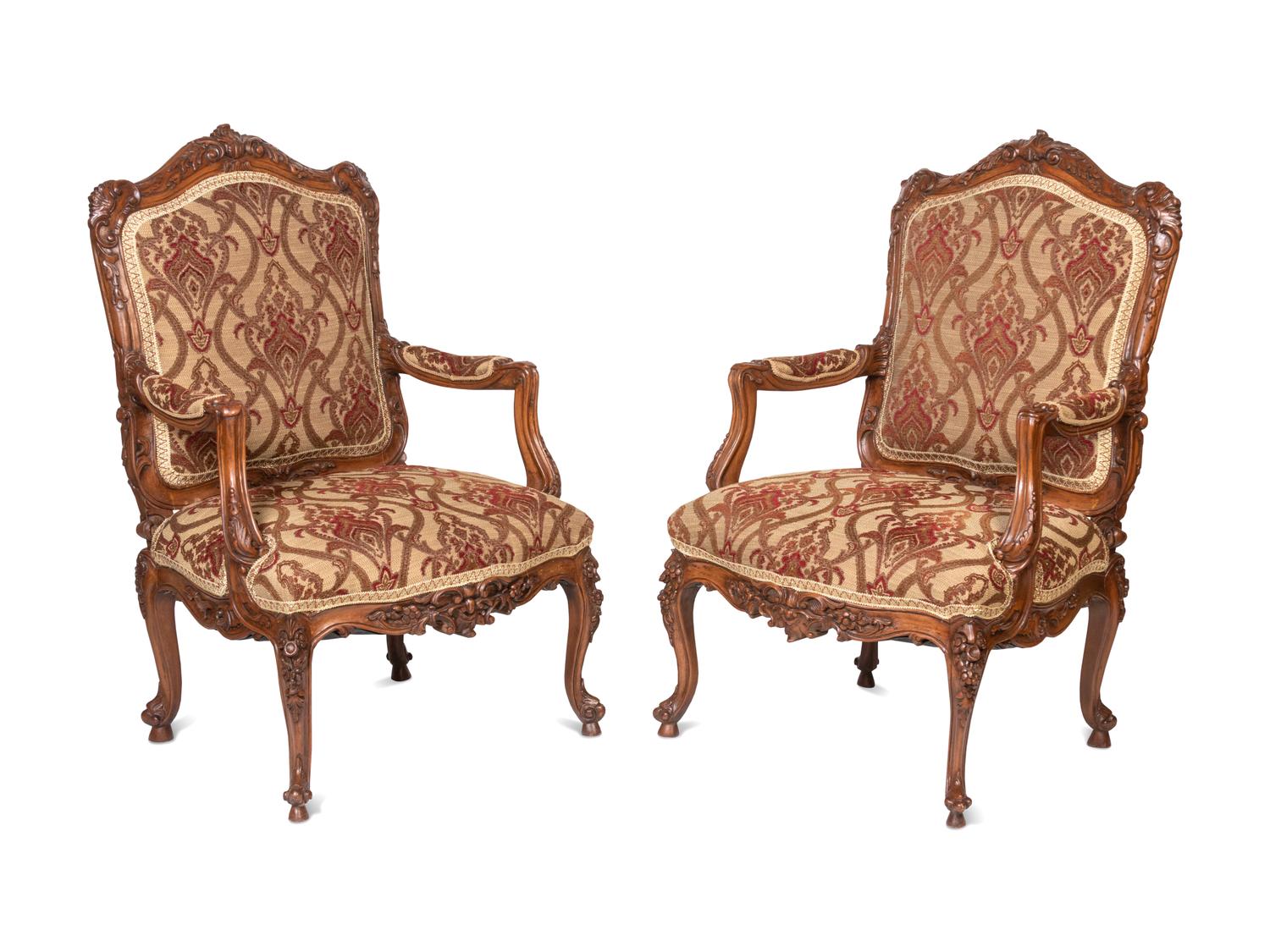 A Pair of Rococo Style Carved Walnut Armchairs
