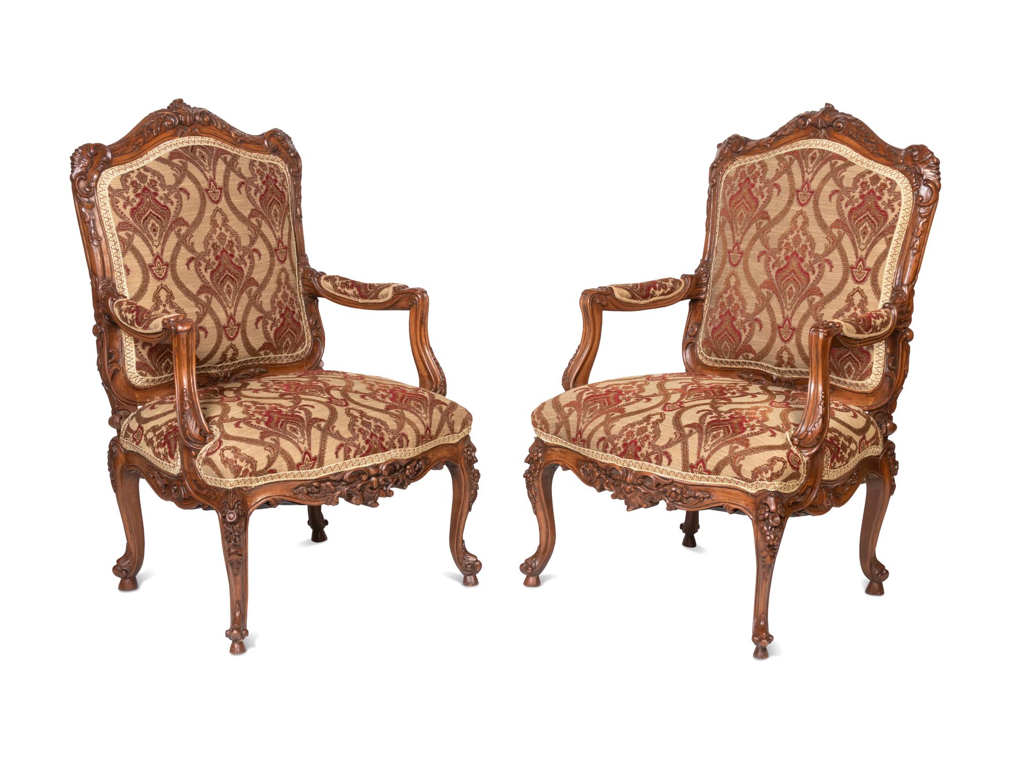 A Pair of Rococo Style Carved Walnut Armchairs
