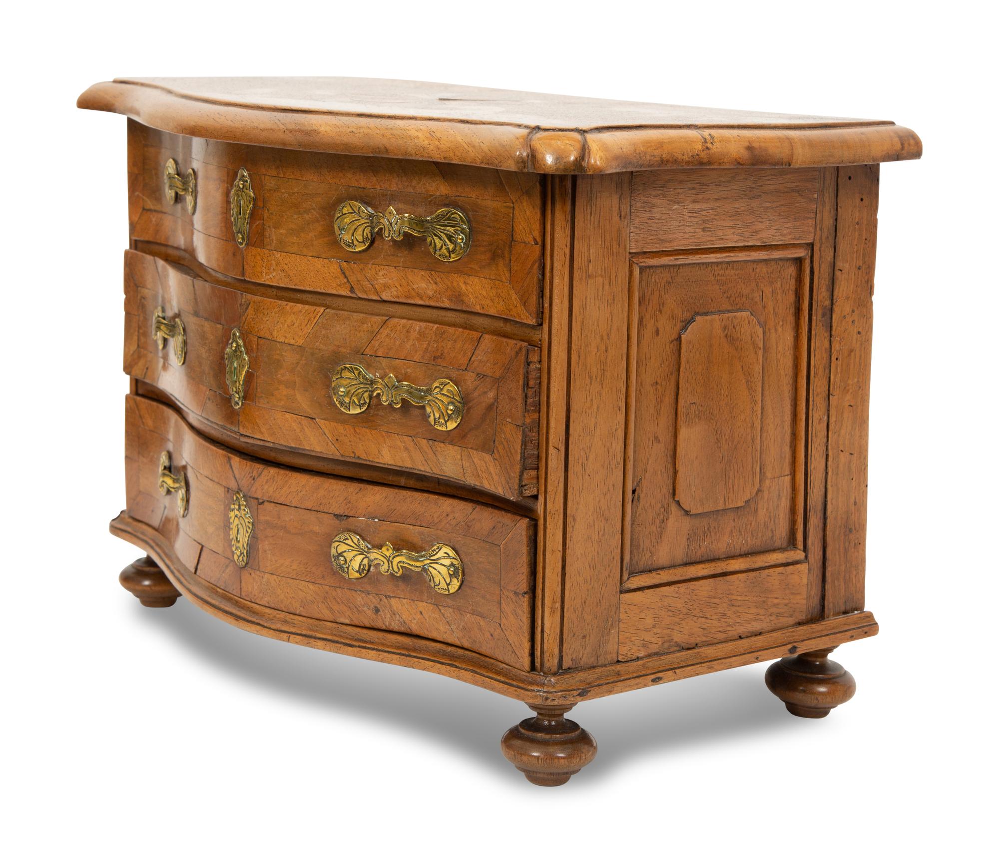A French Walnut Marquetry Miniature Bow Front Commode