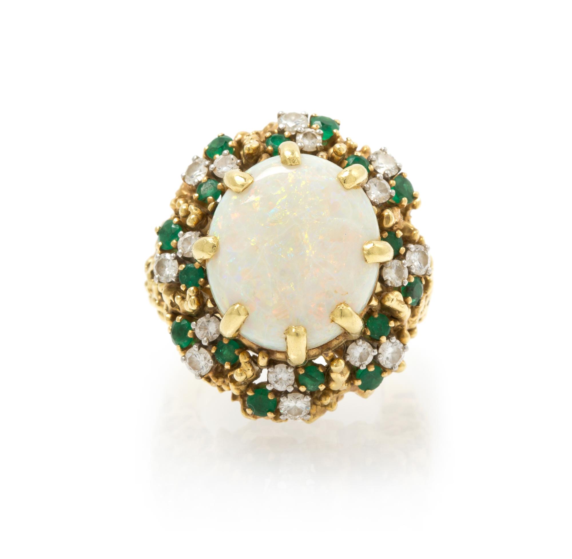 An 18 Karat Yellow Gold, Opal, Emerald and Diamond Ring, 17.70 dwts.