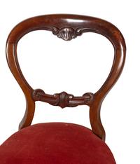 A Set of Four English Mahogany Balloon Back Side Chairs
