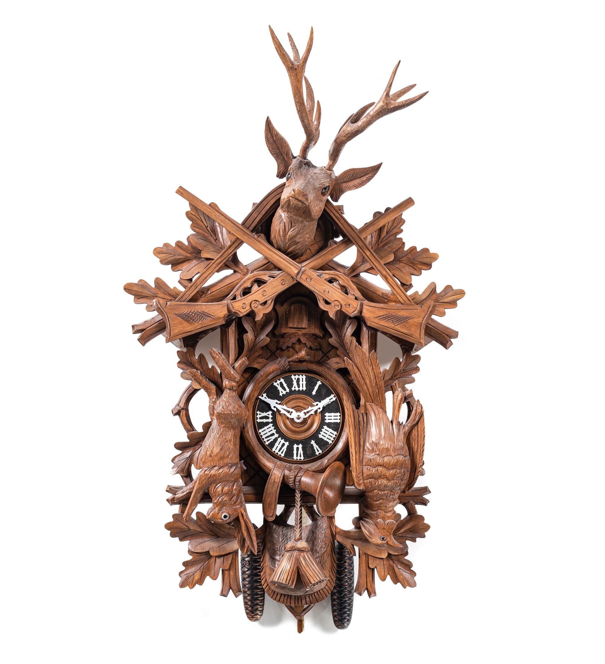 A Black Forest Style Carved Walnut Cuckoo Clock