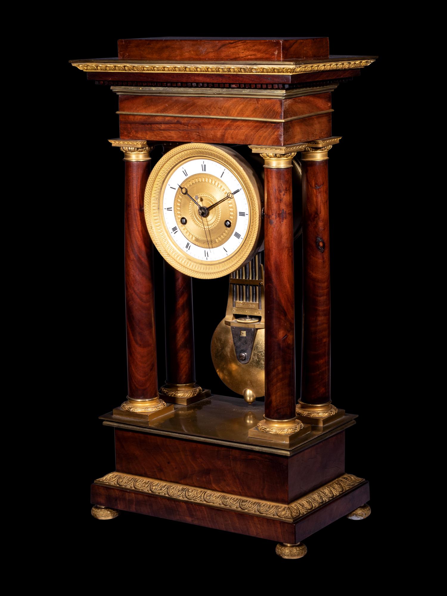 A French Gilt Bronze Mounted Mahogany Portico Clock, Ferrenbach, Chalons