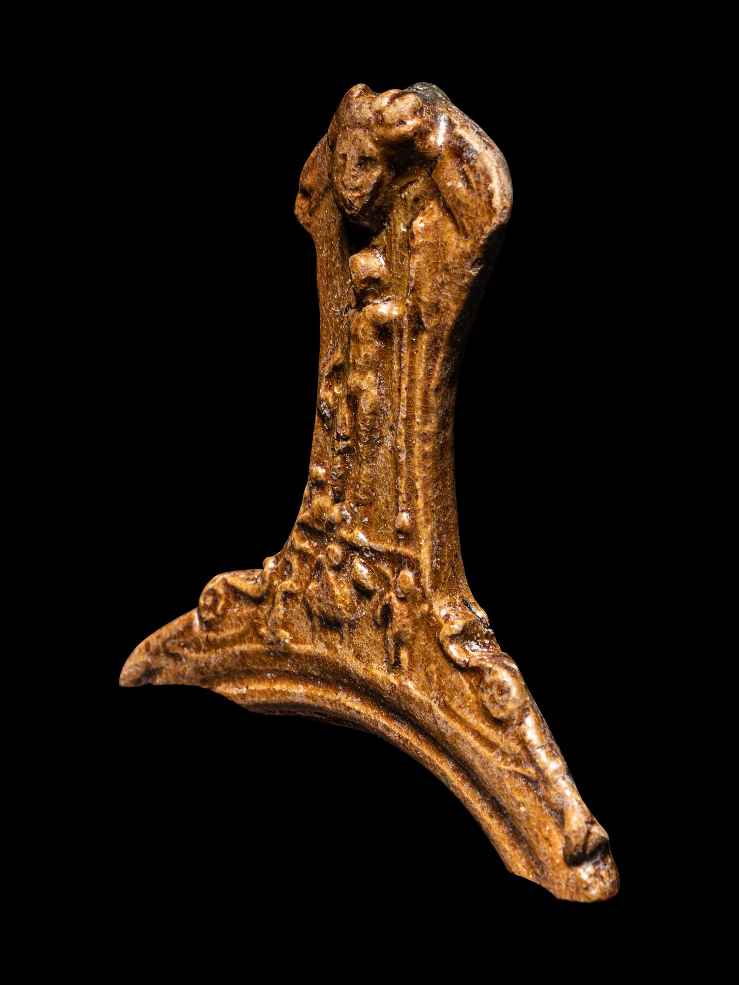 A Hellenistic Molded Glazed Pottery Handle