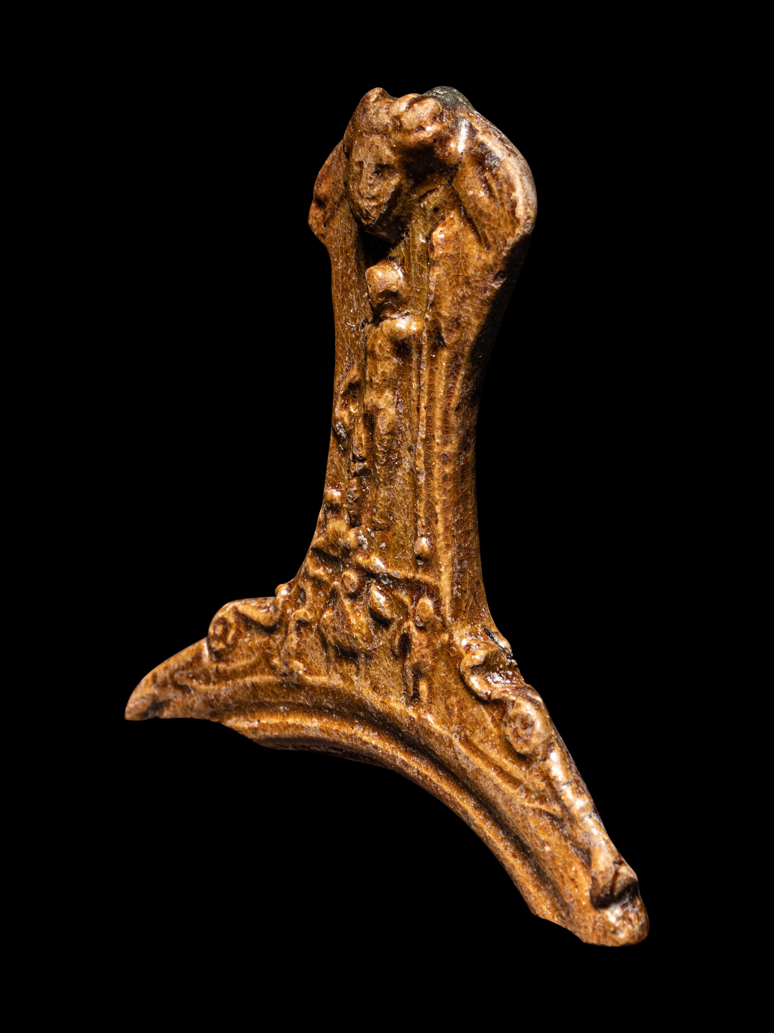 A Hellenistic Molded Glazed Pottery Handle