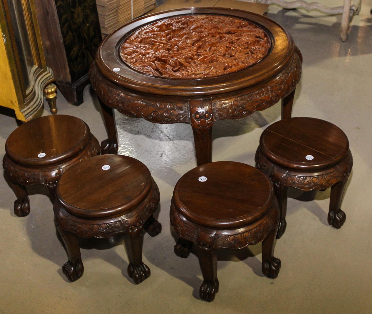 A Chinese Export Carved Wood Low Tea Table. Height 20 x diameter 35 inches.