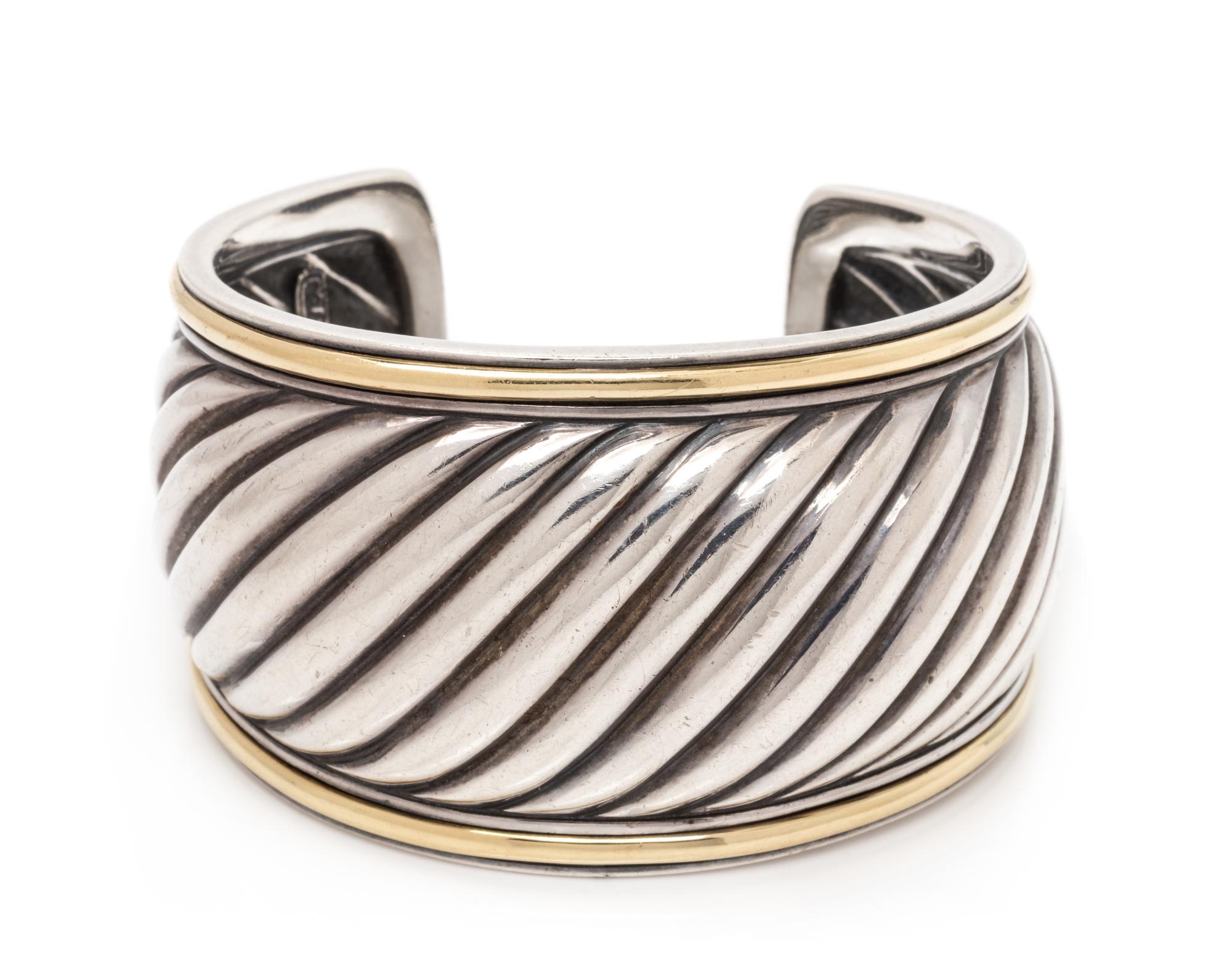A Sterling Silver and 18 Karat Yellow Gold Cuff Bracelet, David Yurman, 46.20 dwts.