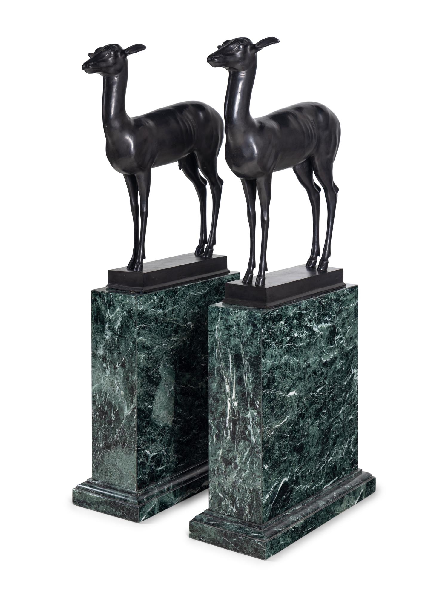 A Pair of Bronze Models of Pompeiian Deer on Marble Plinths