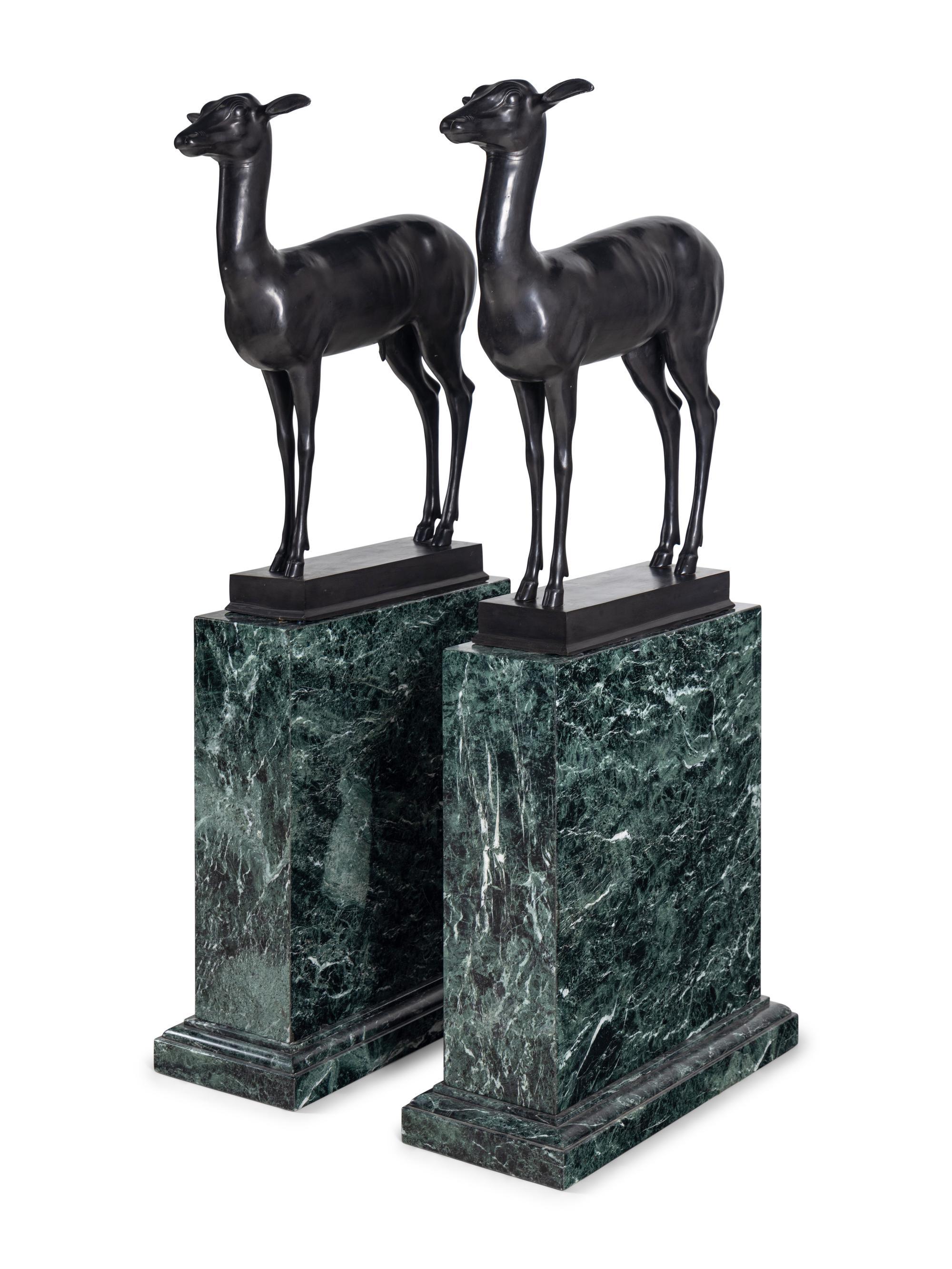 A Pair of Bronze Models of Pompeiian Deer on Marble Plinths