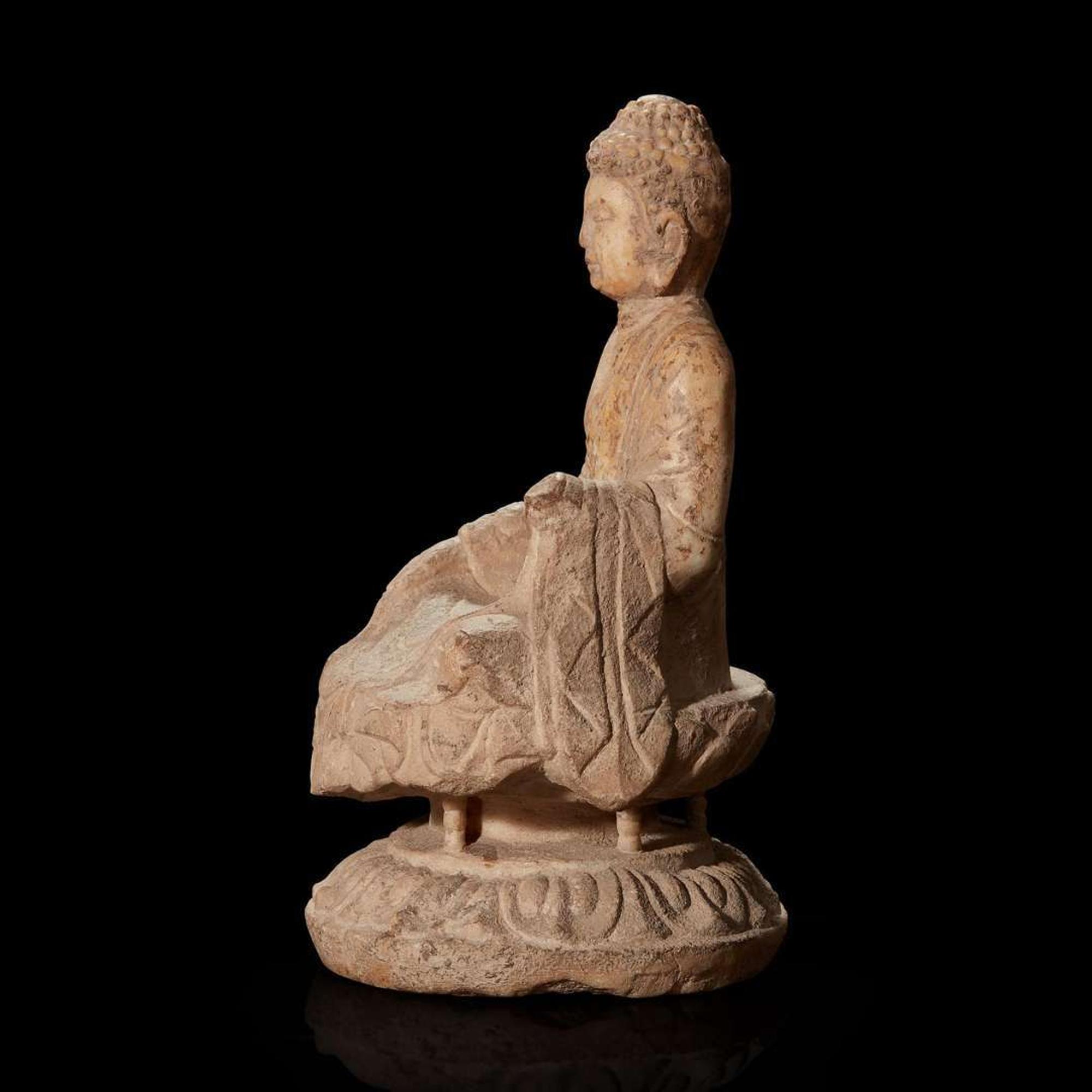 A Chinese carved white marble figure of Buddha seated