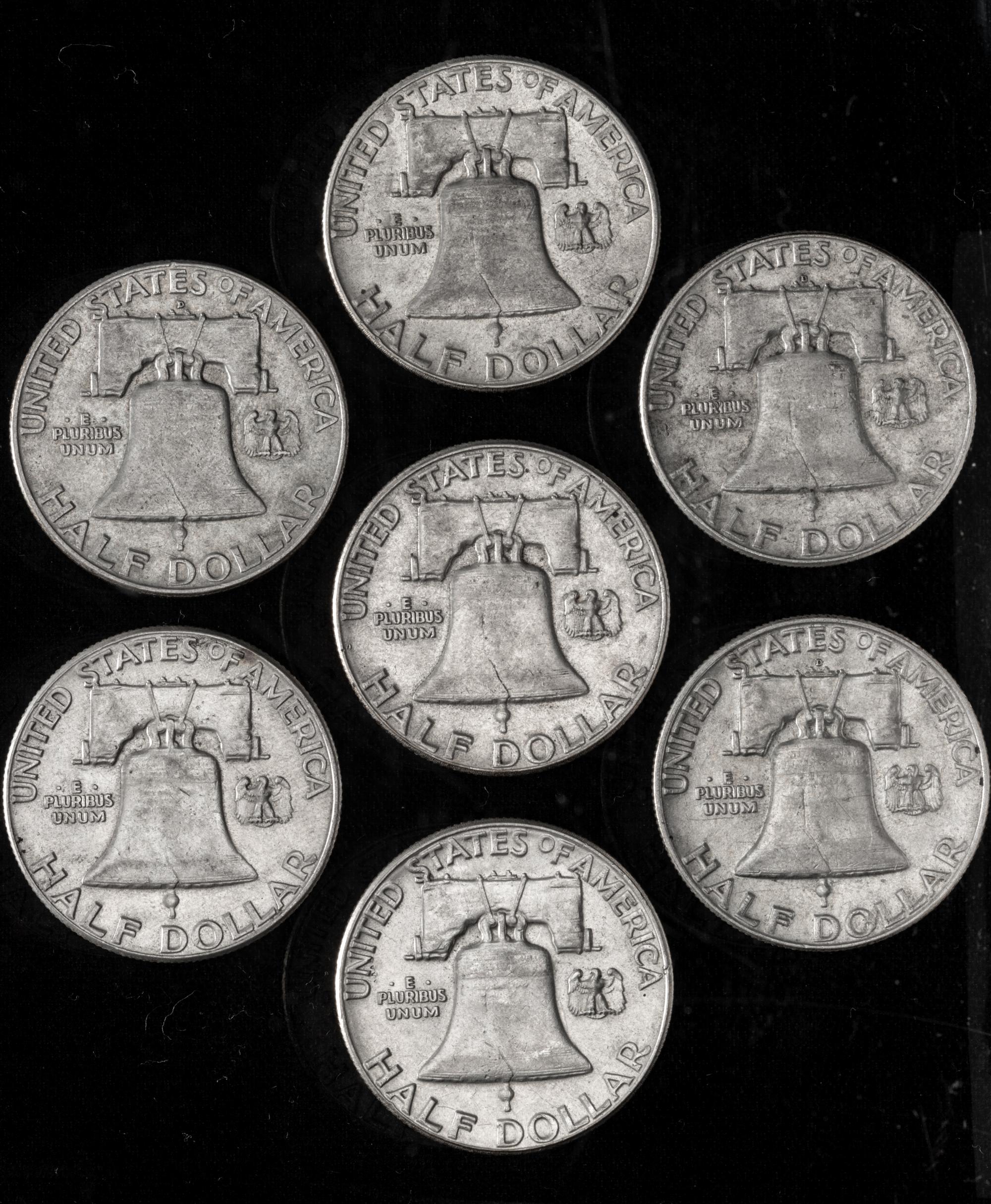 A Collection of Seven United States Benjamin Franklin 50C Coins