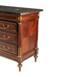 A Louis XVI Style Gilt Bronze Mounted Mahogany Marble-Top Commode