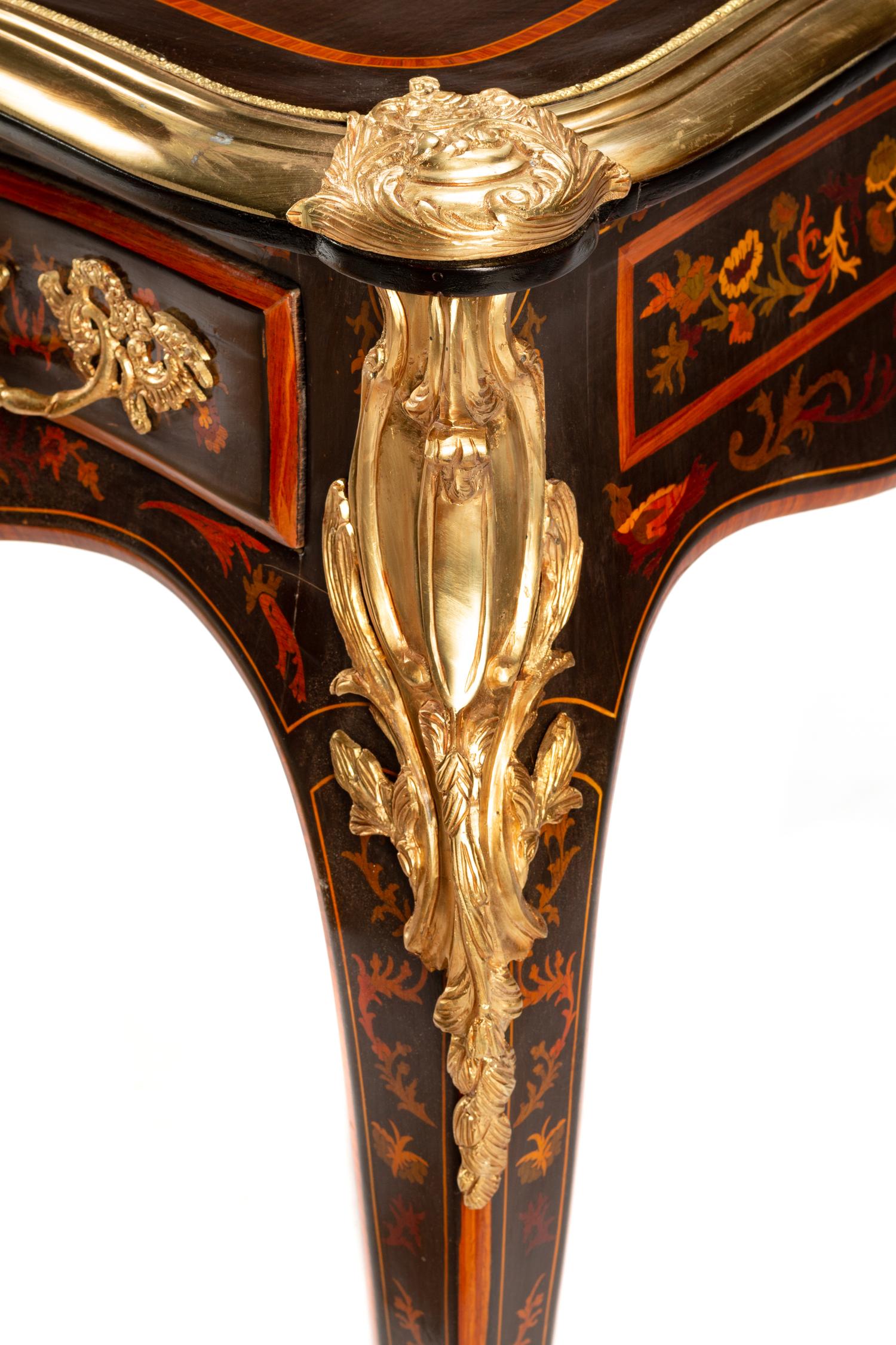 A Louis XV Style Gilt Bronze Mounted Marquetry Bureau Plat
