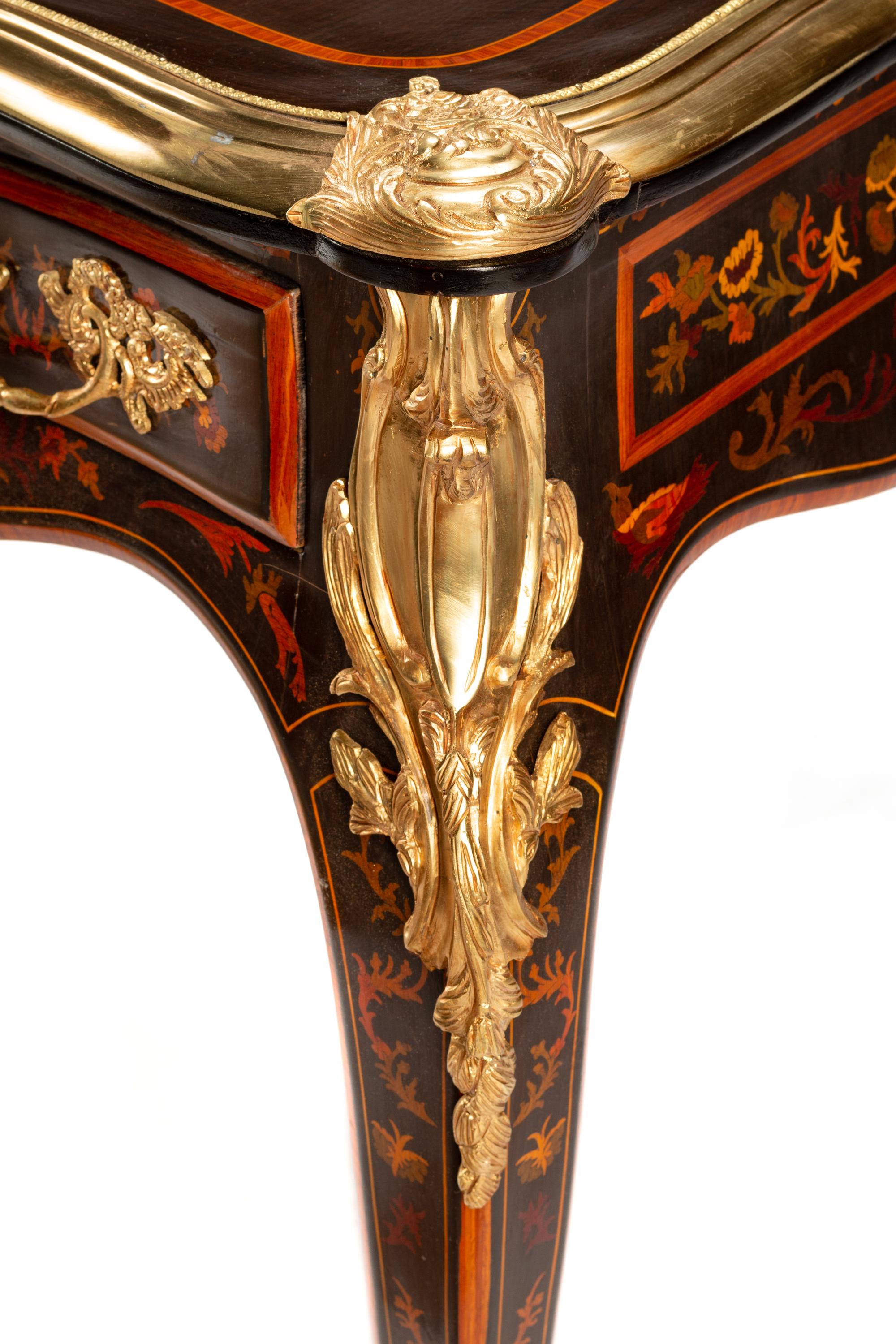 A Louis XV Style Gilt Bronze Mounted Marquetry Bureau Plat