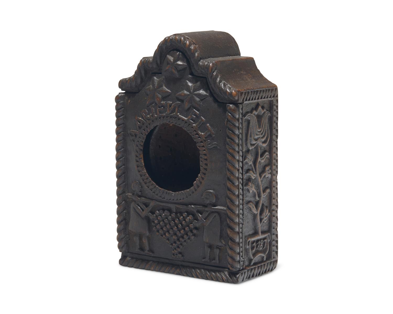 A Continental Carved Walnut Watch Hutch