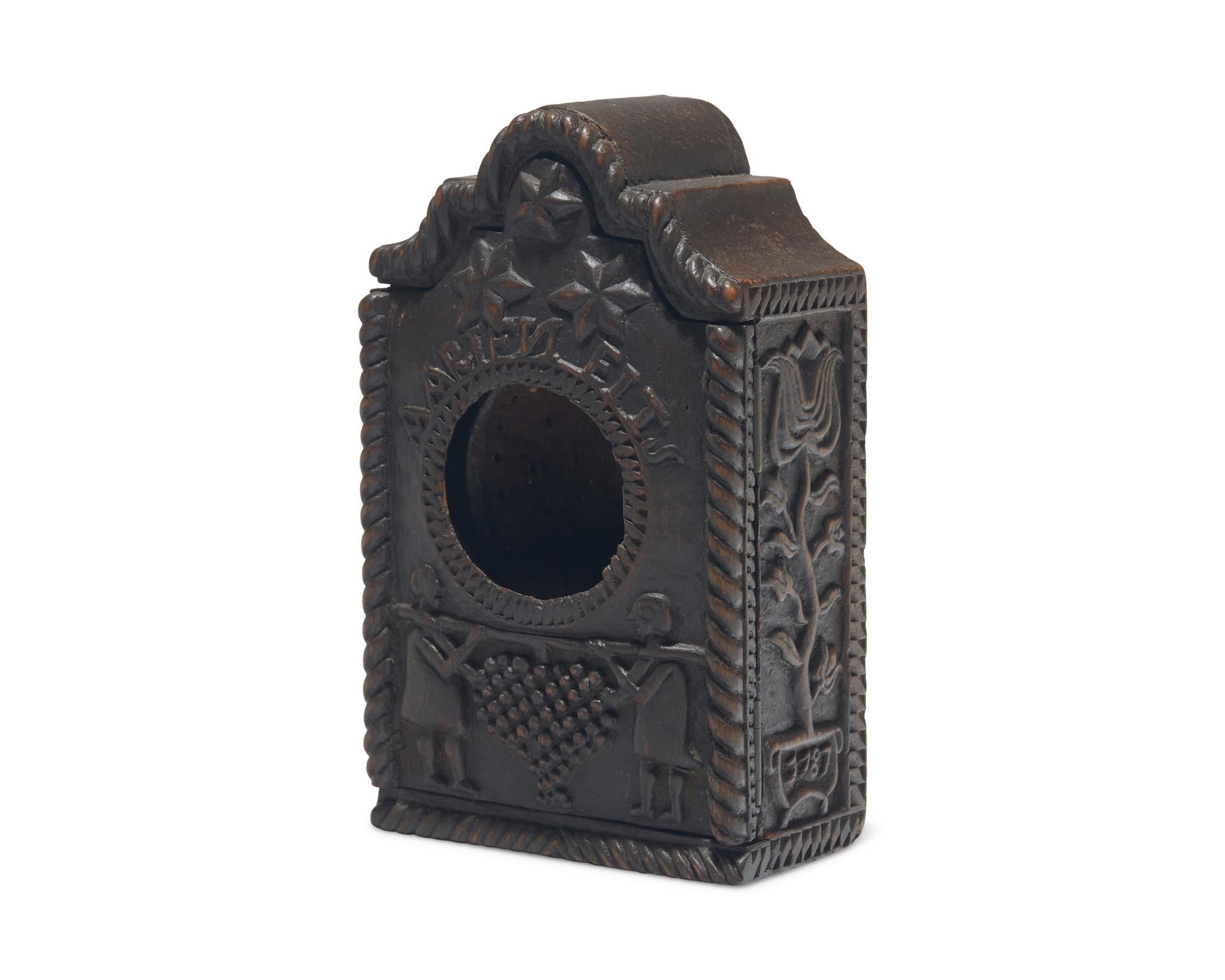 A Continental Carved Walnut Watch Hutch