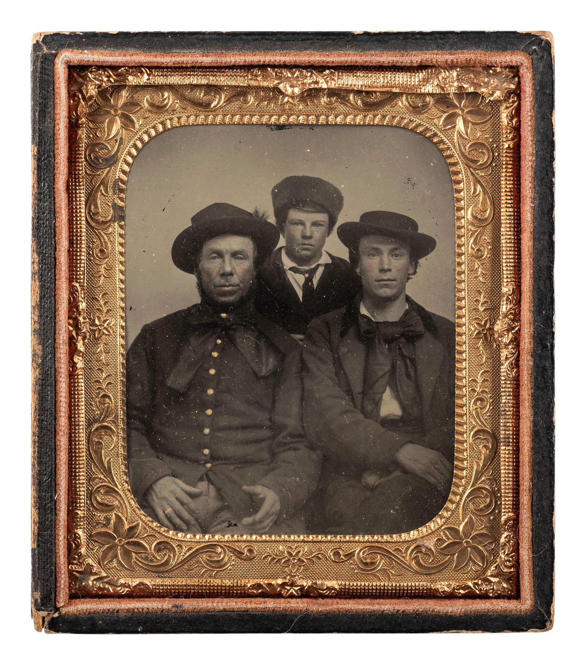 [CIVIL WAR] Sixth plate tintype of three men of varying ages, with a possible Pennsylvania Bucktail.