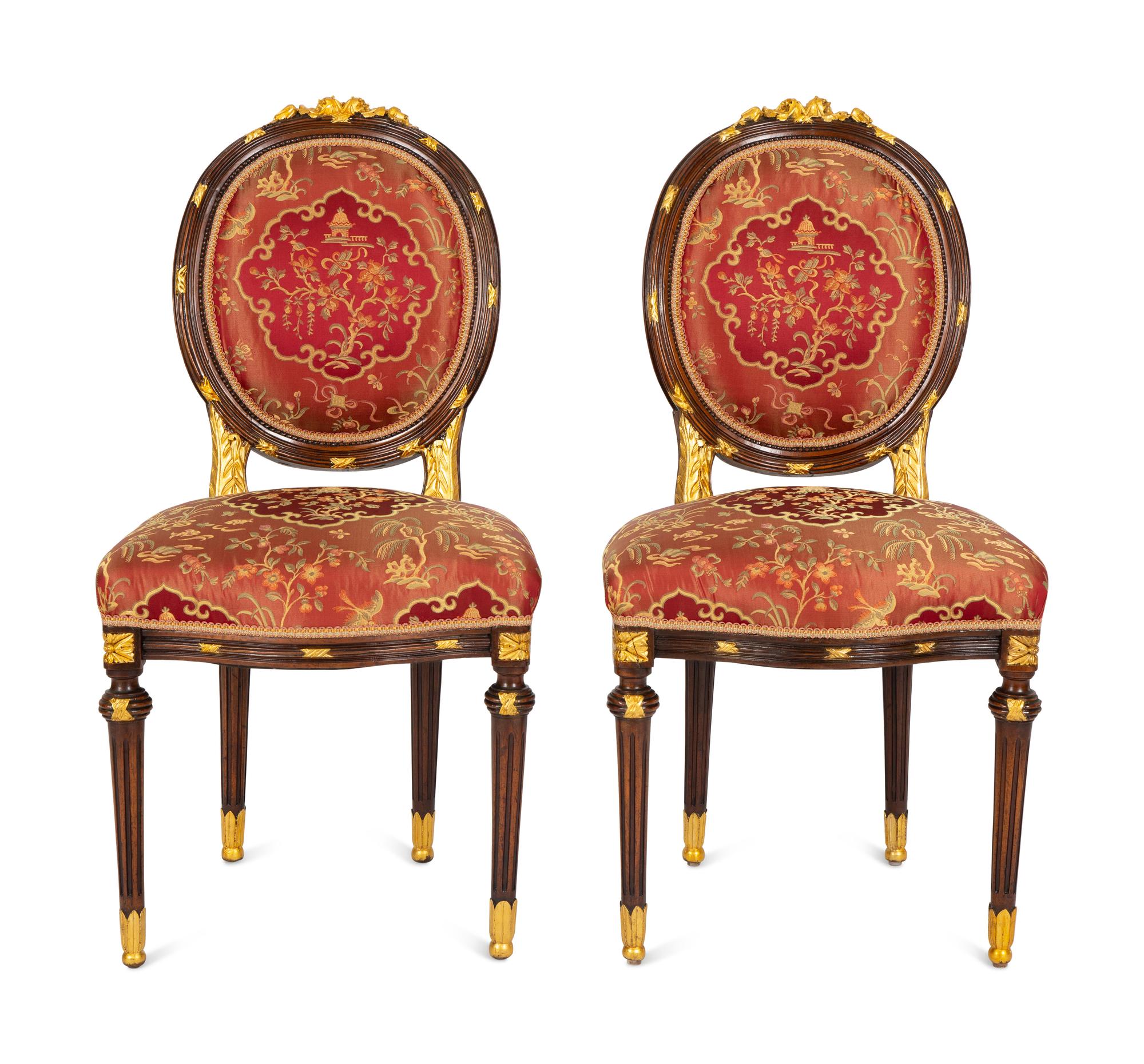 A Pair of Louis XVI Style Stained and Gilt Mahogany Side Chairs.
