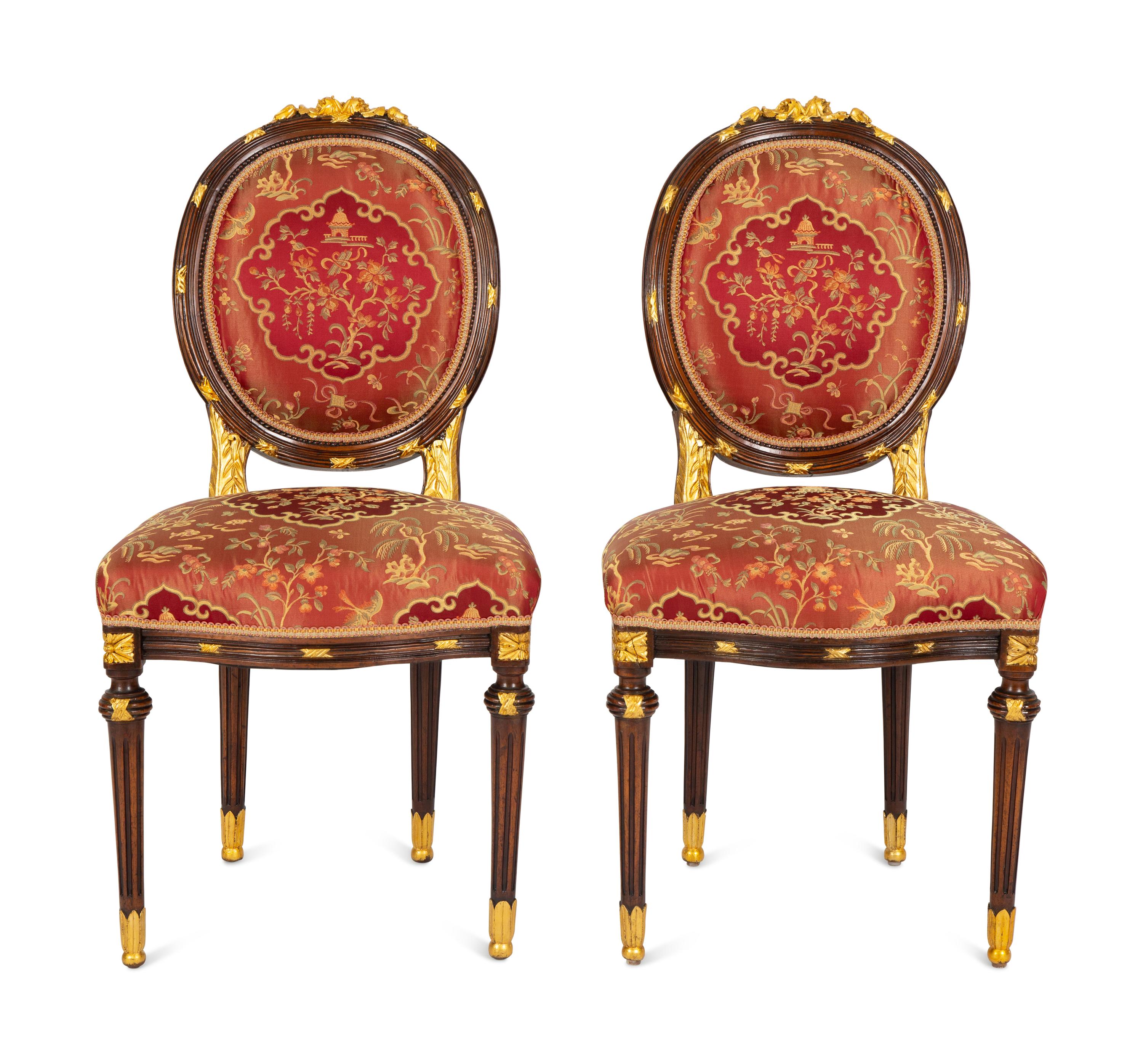 A Pair of Louis XVI Style Stained and Gilt Mahogany Side Chairs.