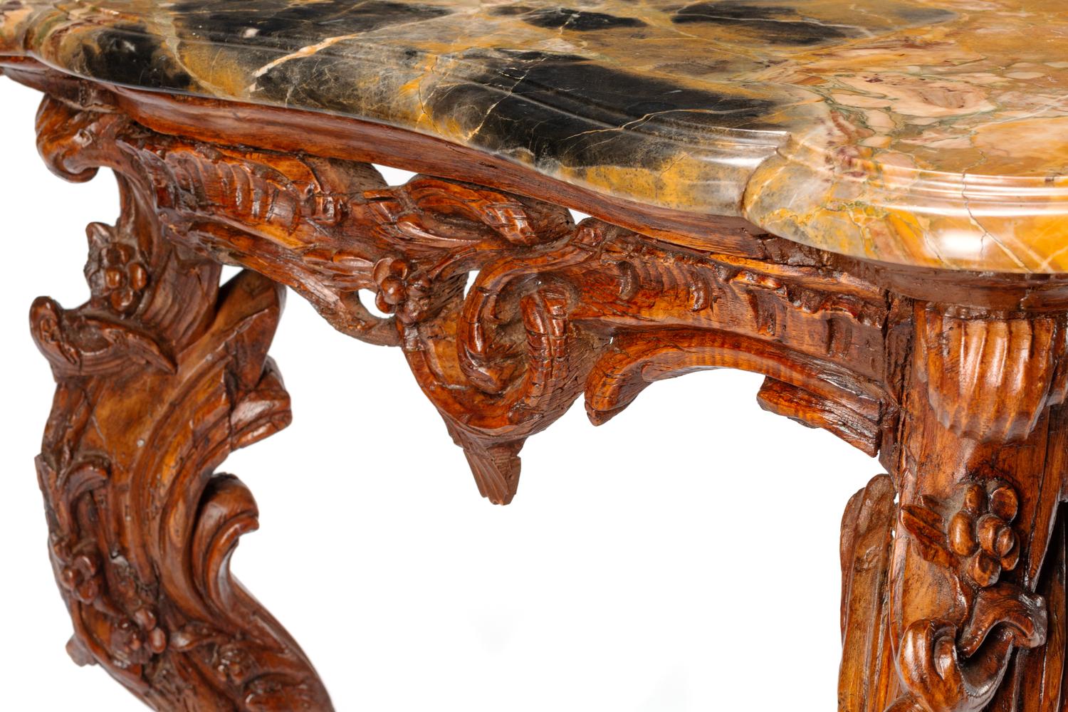 An Italian Rococo Carved Walnut Marble-Top Console Table