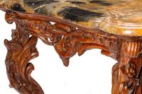 An Italian Rococo Carved Walnut Marble-Top Console Table