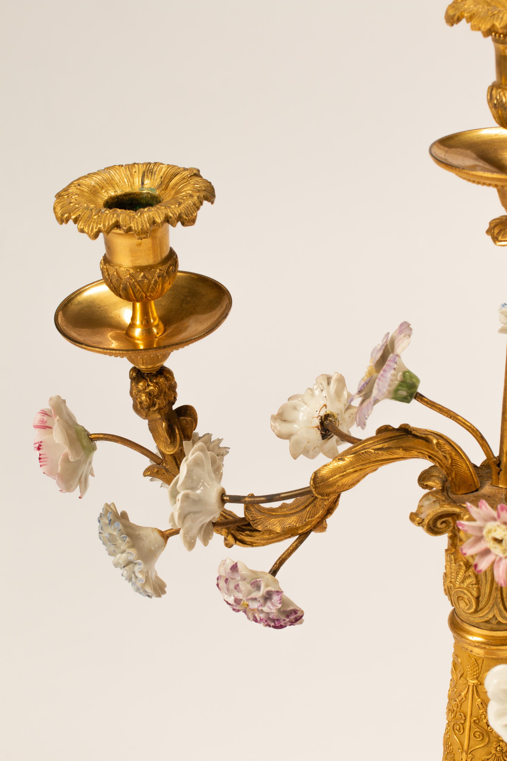 A Pair of Charles X Gilt Bronze and Porcelain Four-Light Candelabra