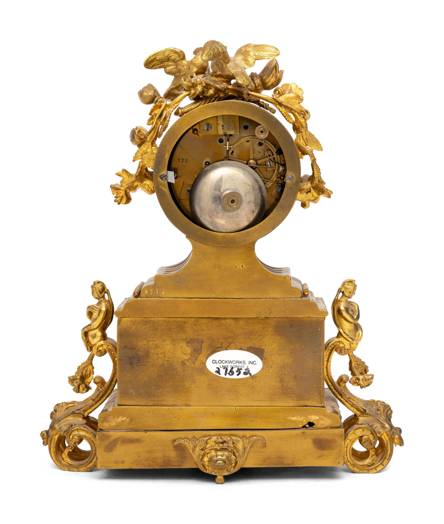 A French Gilt Metal and Porcelain Clock