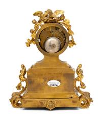 A French Gilt Metal and Porcelain Clock