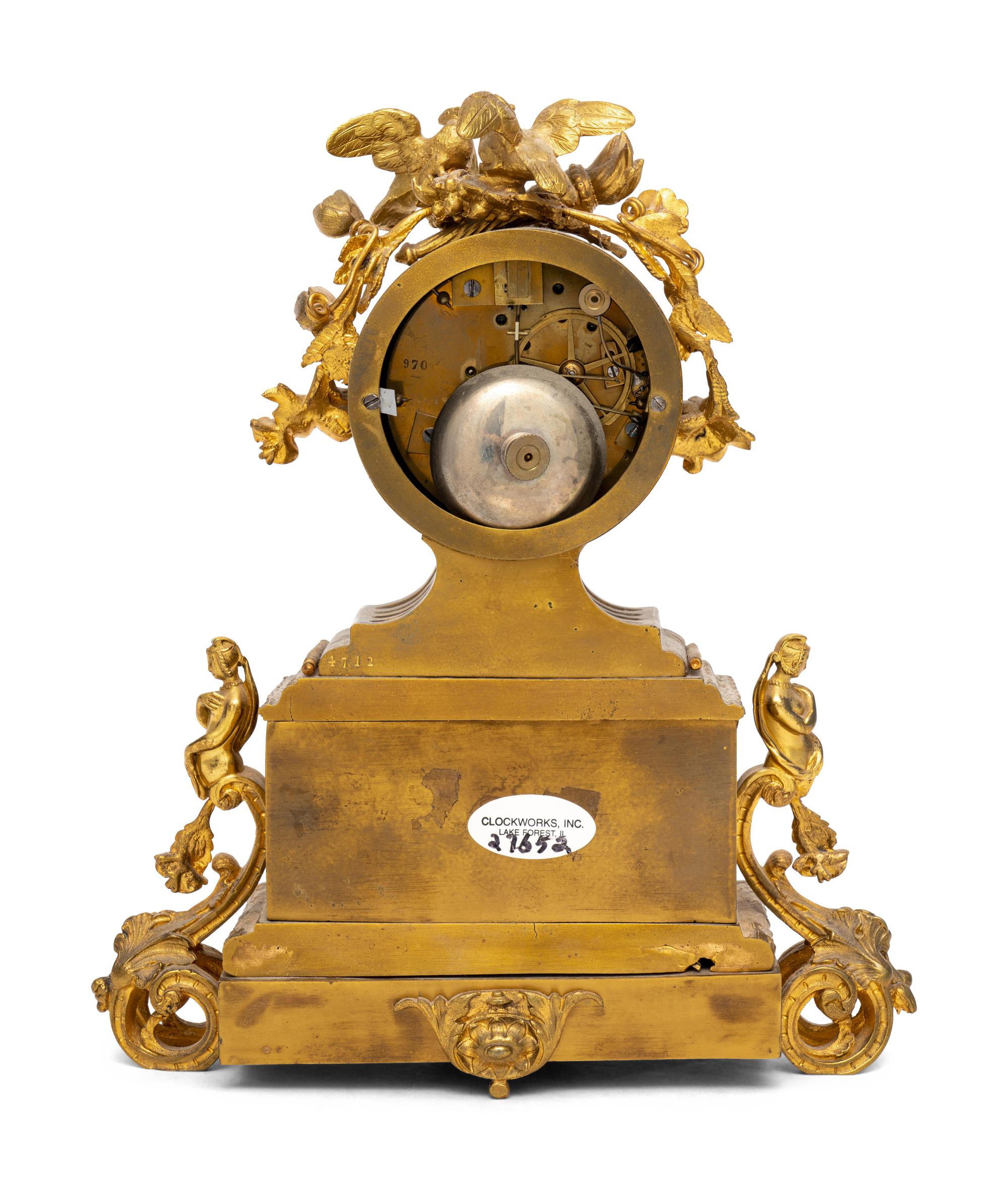 A French Gilt Metal and Porcelain Clock