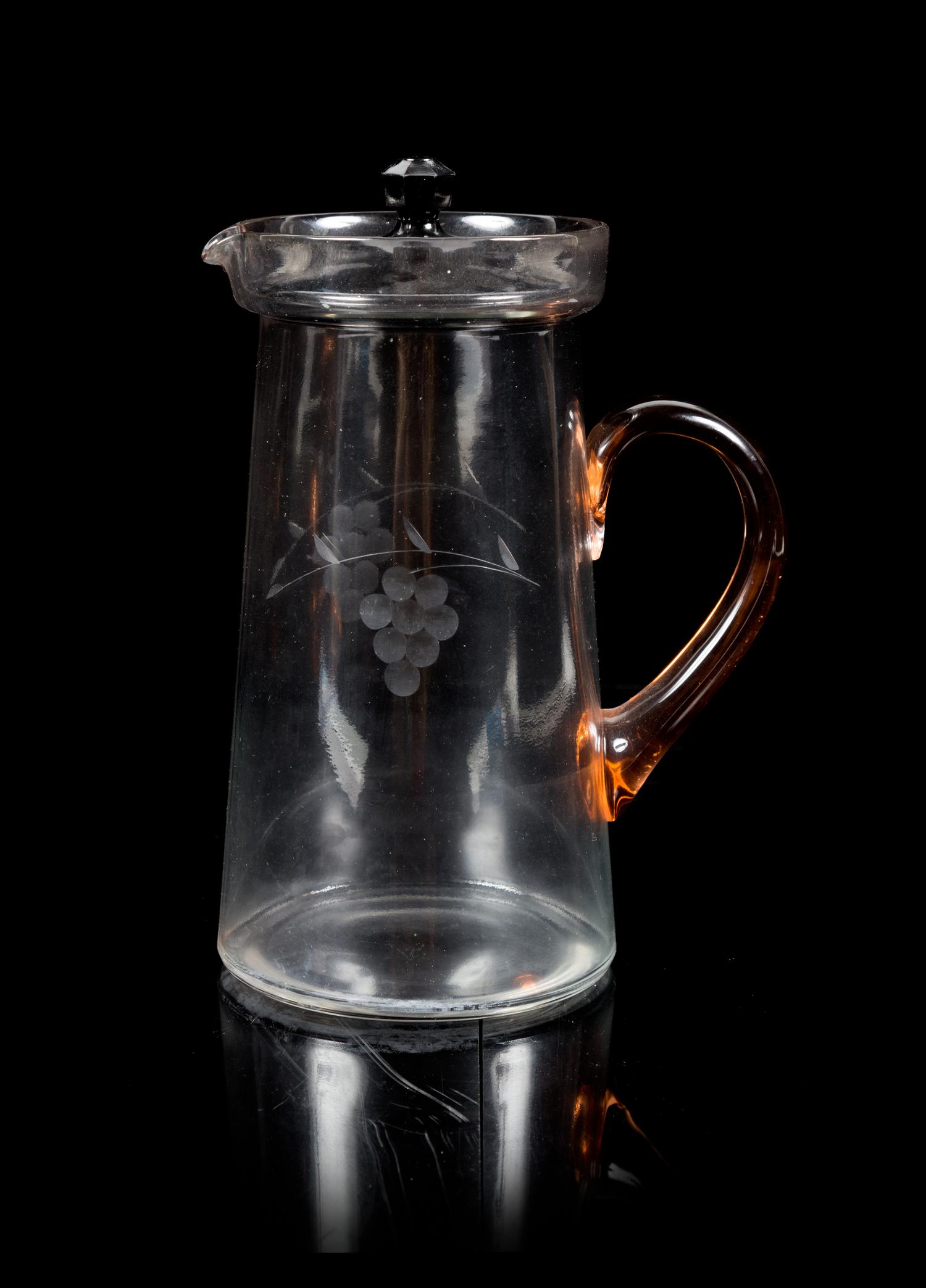 An Engraved Glass Covered Pitcher, Fenton Height 10 1/4 inches