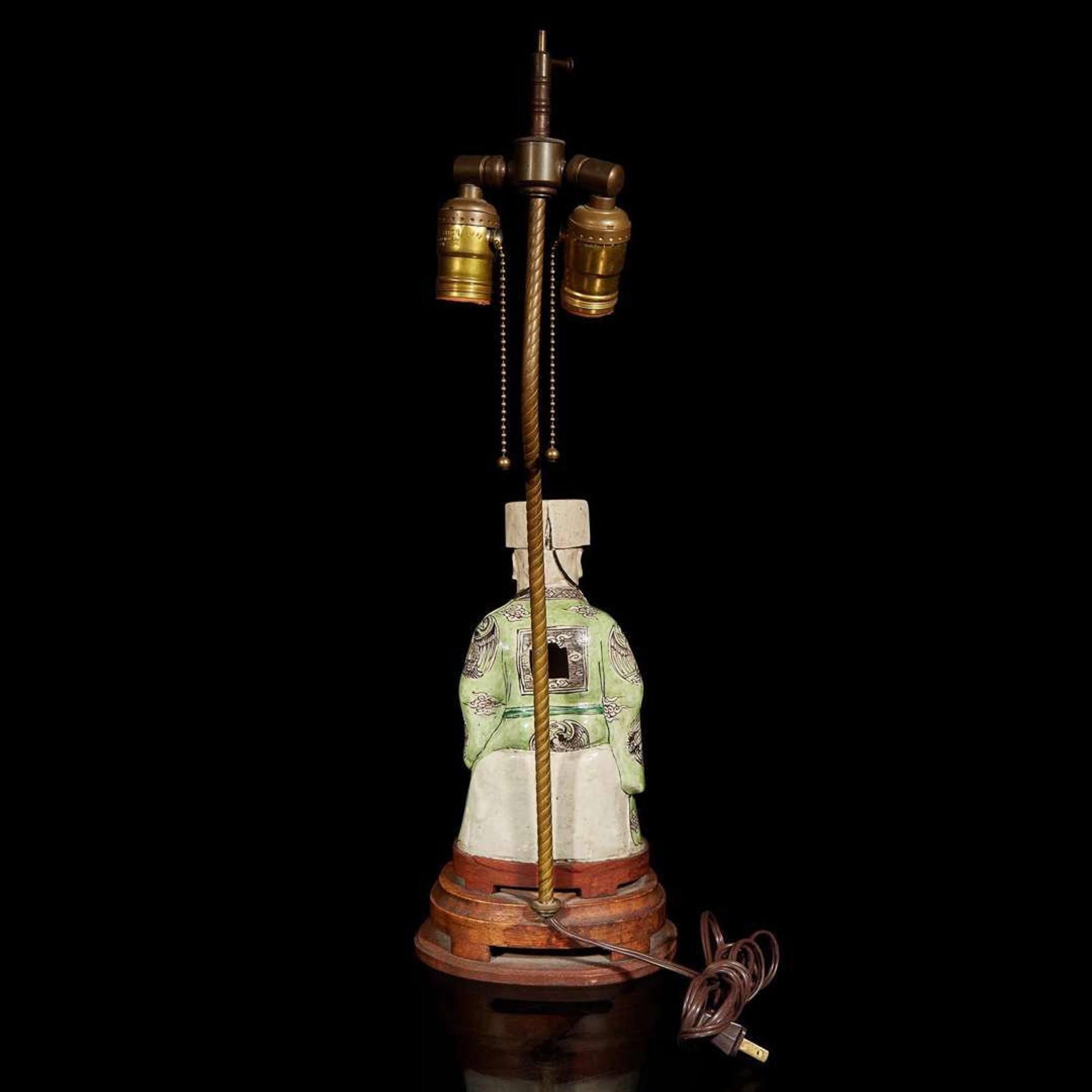 A Chinese famille verte-decorated figure of Cai Shen, mounted as lamp 素三彩財神改制檯燈 Kangxi period ???