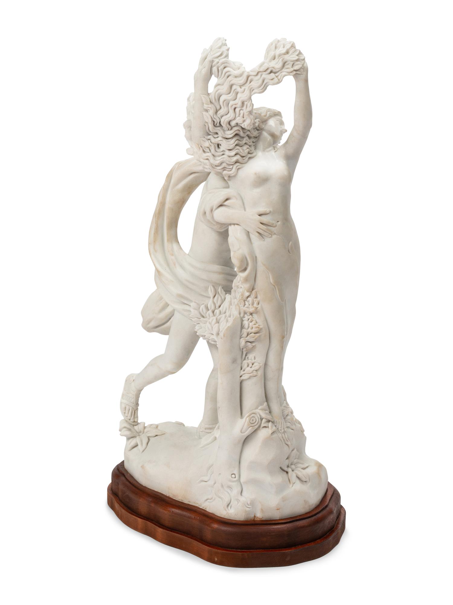 A Continental Marble Figural Group on a Wood Base