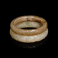 Two Chinese Carved Precious Stone Bangles, Qing Dynasty or Earlier 清或以前 青玉、瑪瑙雕螭龍紋鐲各一