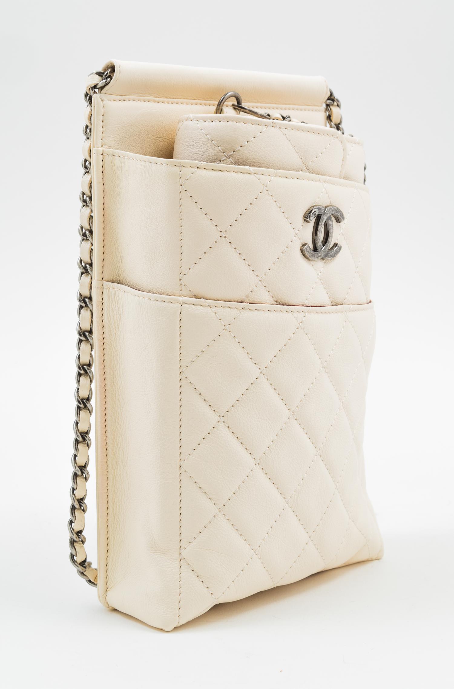 A Chanel Cream Leather Cross Body Pouch with Wallet, Bag: 5.5" x 10" x 1.5"; Wallet: 7.5" x 4.5" x 1.5".