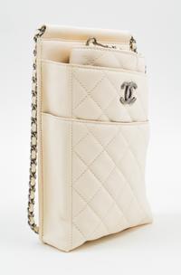 A Chanel Cream Leather Cross Body Pouch with Wallet, Bag: 5.5" x 10" x 1.5"; Wallet: 7.5" x 4.5" x 1.5".