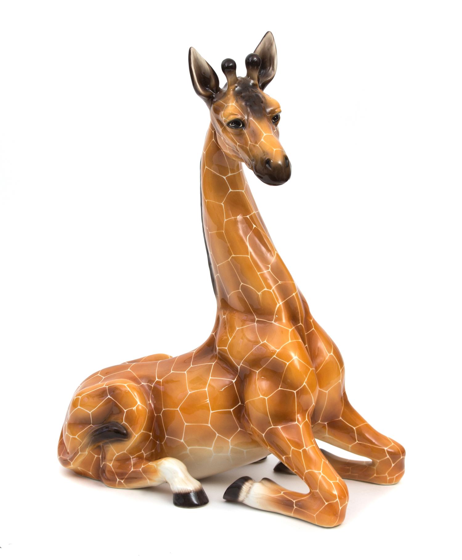 A Glazed Ceramic Model of a Seated Giraffe Height 36 inches. — 20TH CENTURY