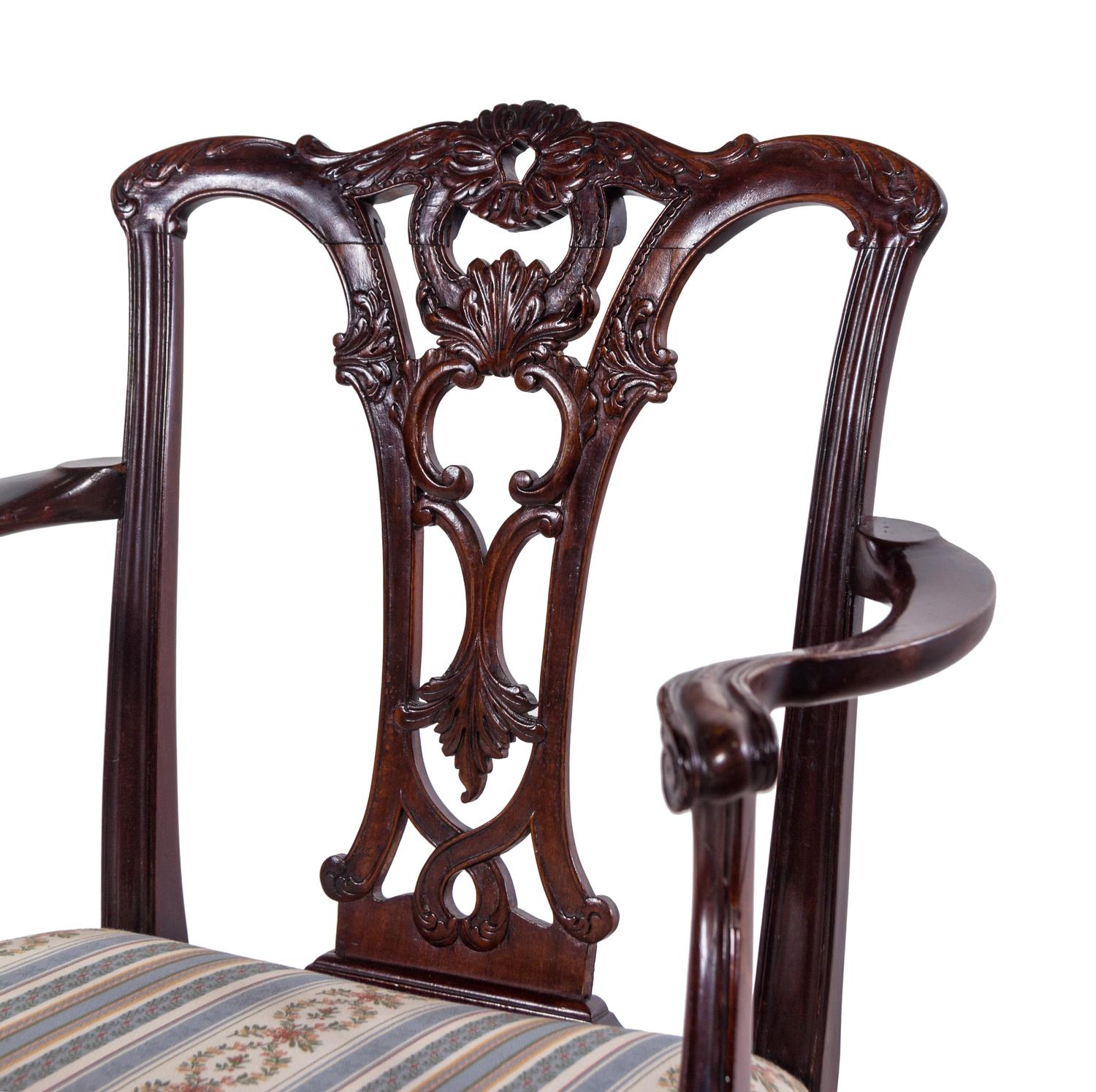 A Set of Fourteen George III Style Carved Mahogany Dining Chairs