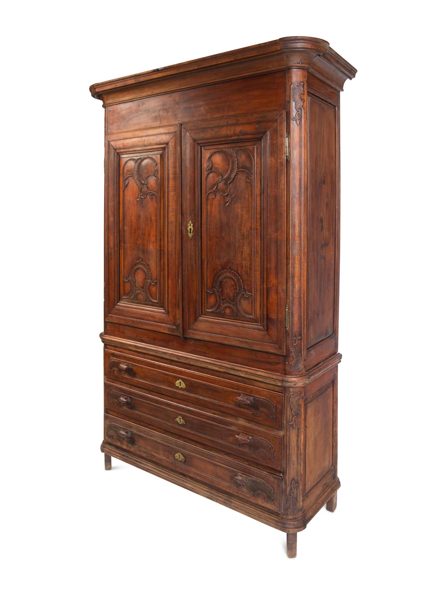 A Louis XV Carved Walnut Cabinet