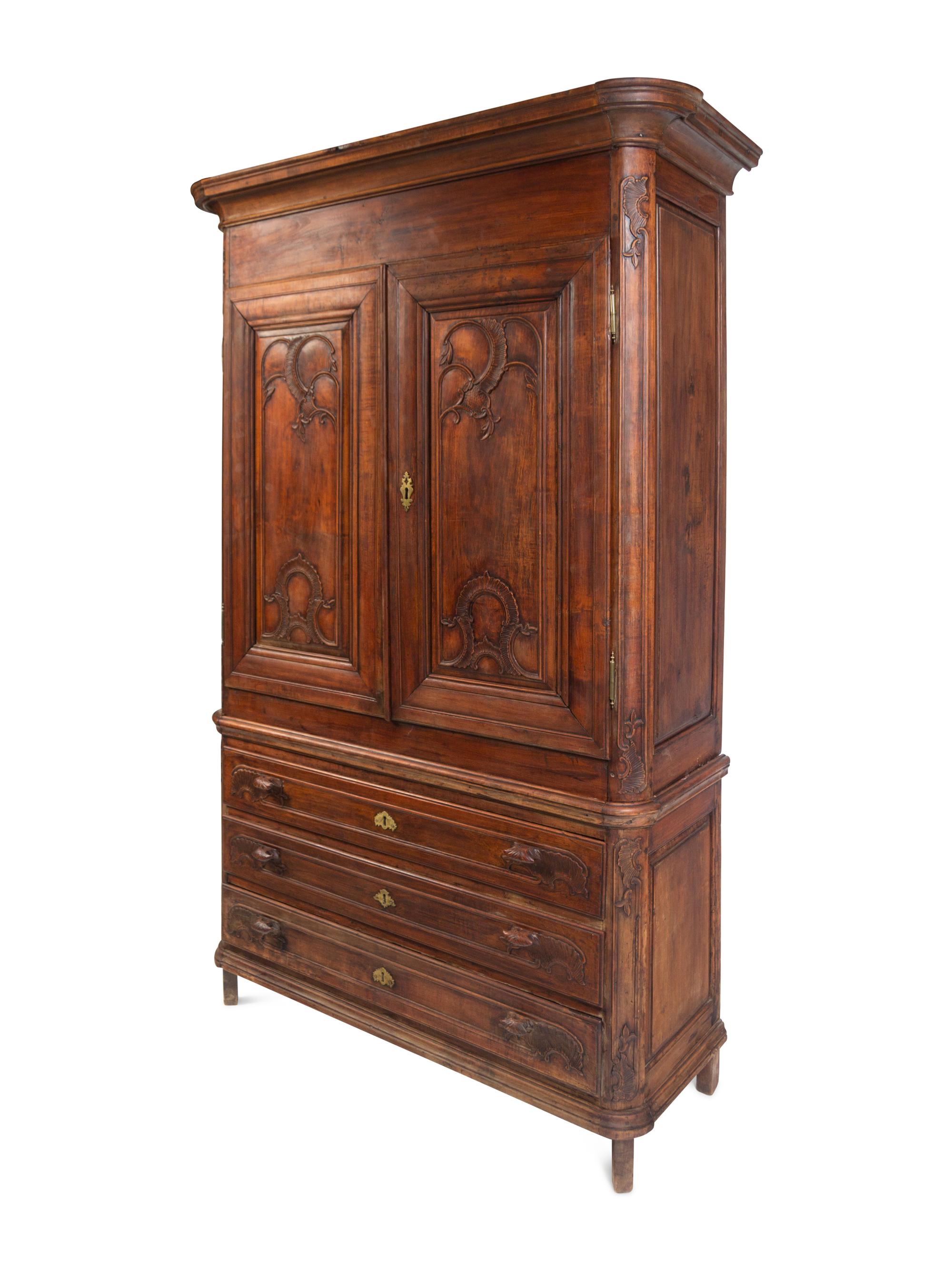 A Louis XV Carved Walnut Cabinet