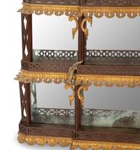A George III Style Pierce Carved and Parcel Gilt Mahogany and Mirror Glass Pagoda-Form Hanging Étagère