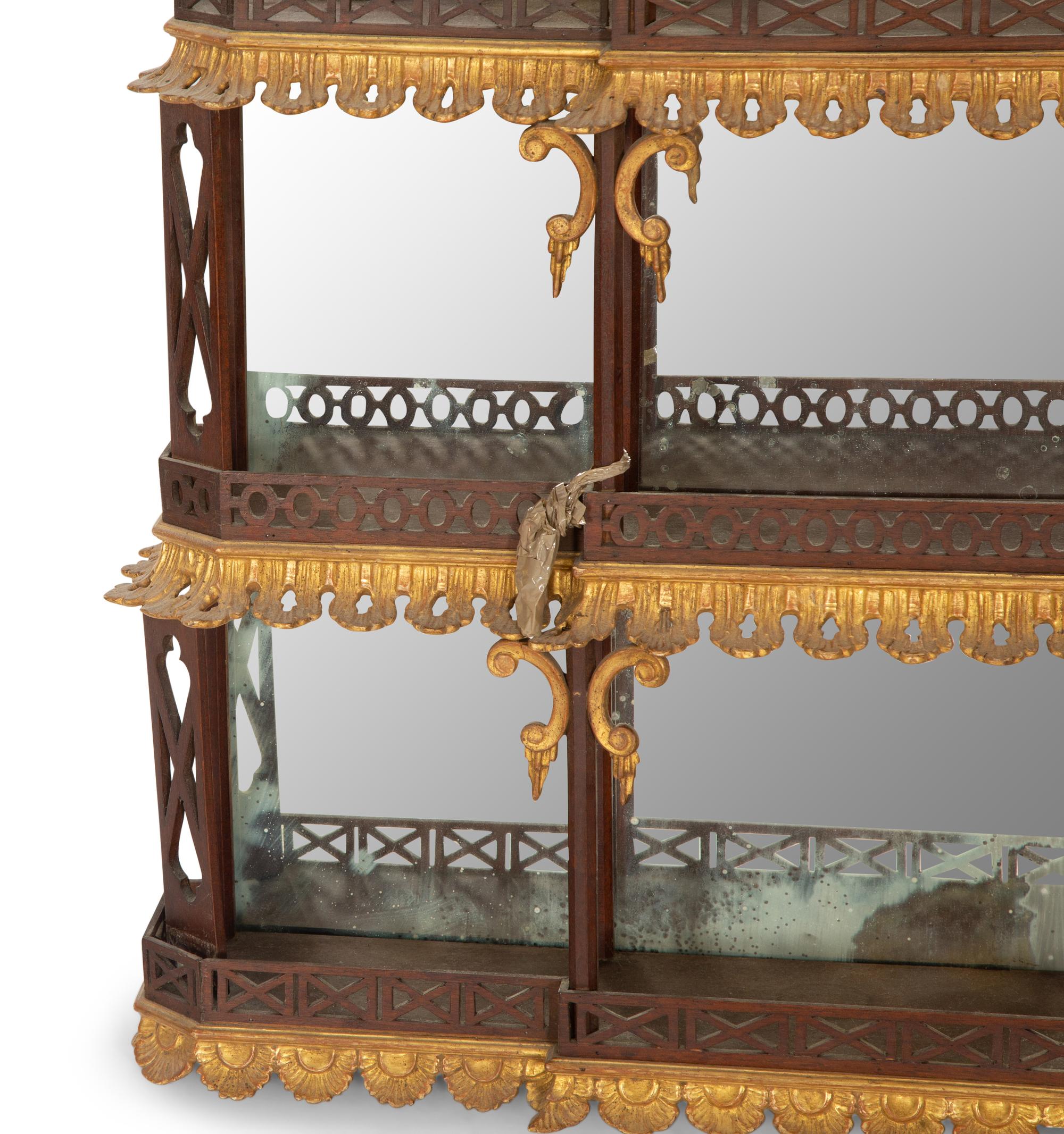 A George III Style Pierce Carved and Parcel Gilt Mahogany and Mirror Glass Pagoda-Form Hanging Étagère