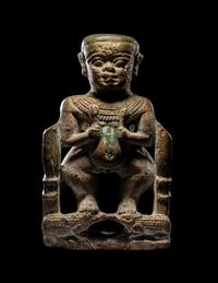 An Egyptian Glazed Steatite Amulet of Pataikos on Crocodiles