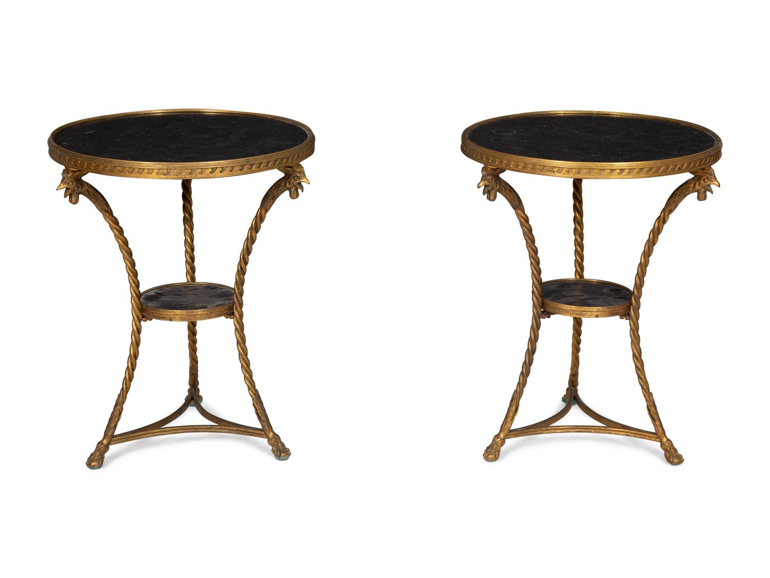 A Pair of French Neoclassical Gilt Bronze Gueridons with Inset Black Marble Tops
