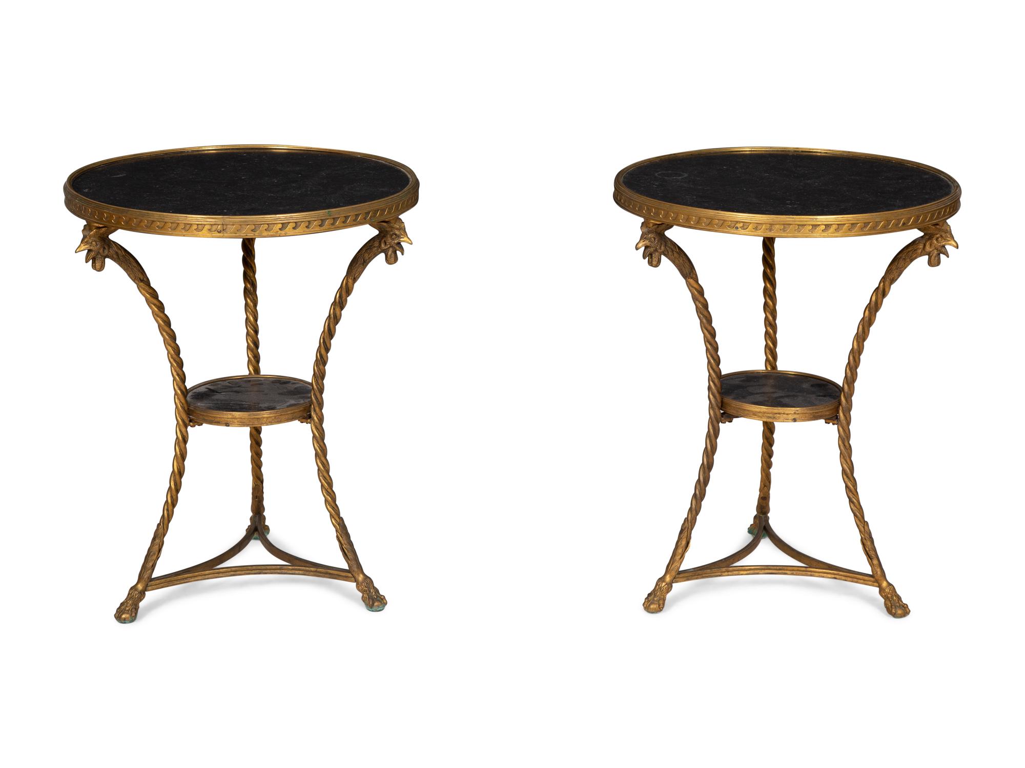 A Pair of French Neoclassical Gilt Bronze Gueridons with Inset Black Marble Tops